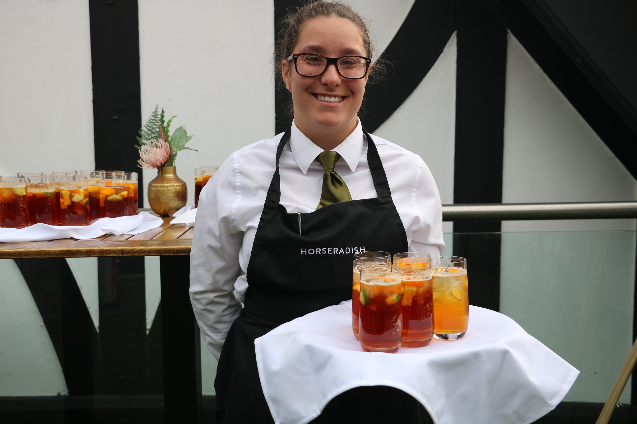 Horseradish catering staff holding summer cocktails for summer party