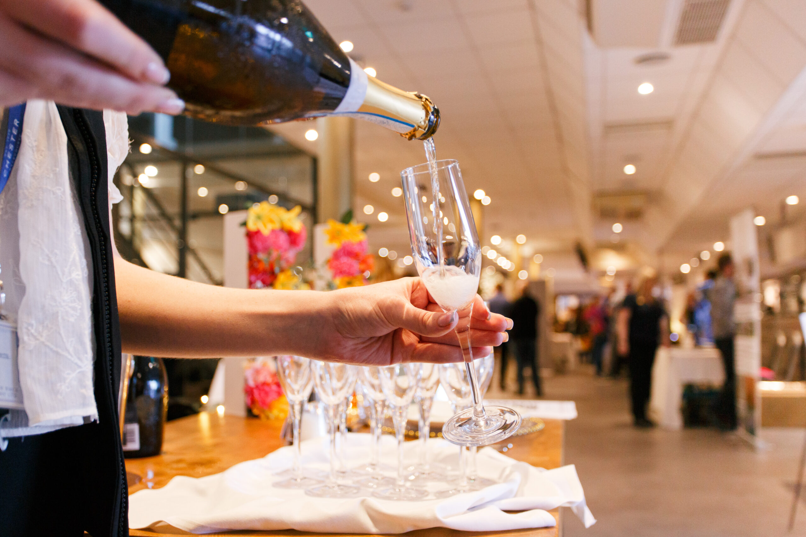 glass of champagne being poured